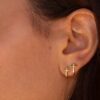 boucle d'oreille croix or jaune et diamants blancs or recyclé 18 carats obsession aupiho joaillerie